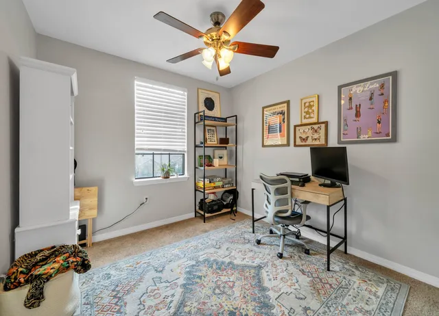 a workspace with furniture and window