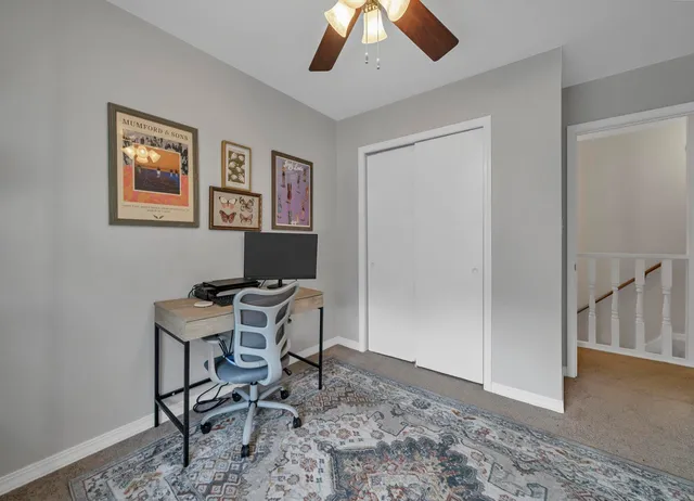 a workspace with furniture and window