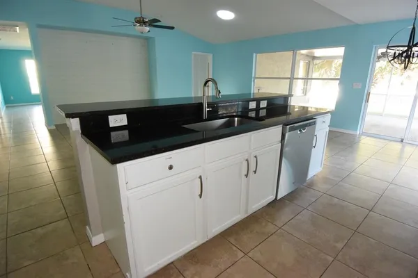 a kitchen with a sink and cabinets