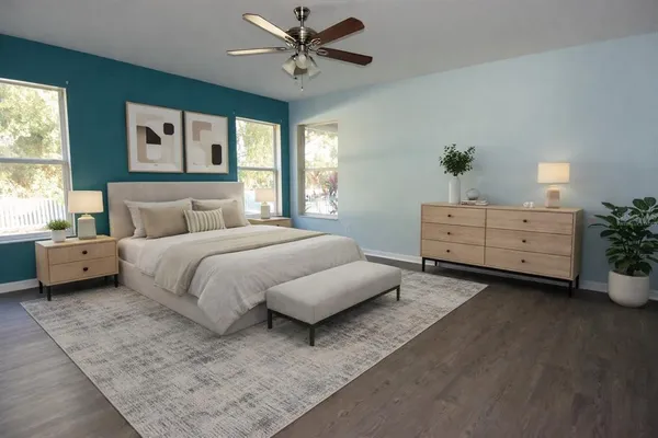 a bedroom with a bed and window