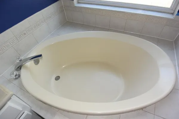 a bathroom with a toilet a sink and a window