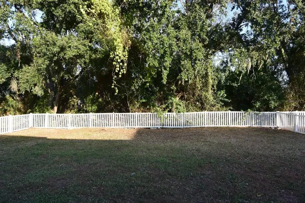 a house view with a backyard space