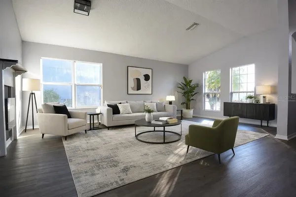 a living room with furniture and a table