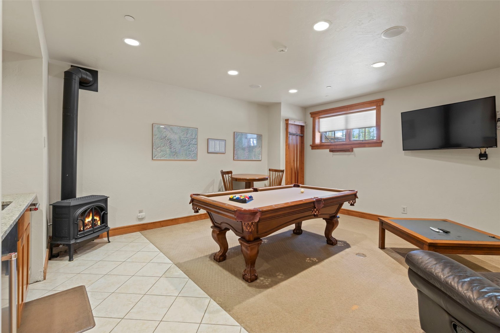 317 Timbertrail Road Breckenridge, CO 80424 - Photo 32 of 50 a room with furniture pool table flat screen tv and windows