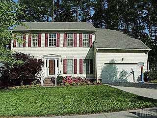 5620 Barham Court Raleigh, NC 27613 - Photo 1 of 1 a backyard of a house with potted plants and large tree