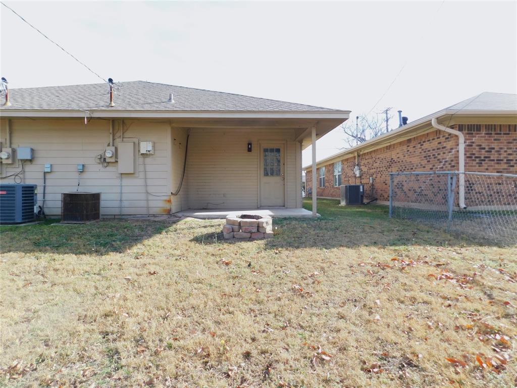 2214 Bernard Street Denton, TX 76205 - Photo 16 of 16 a view of a dry yard with wooden fence