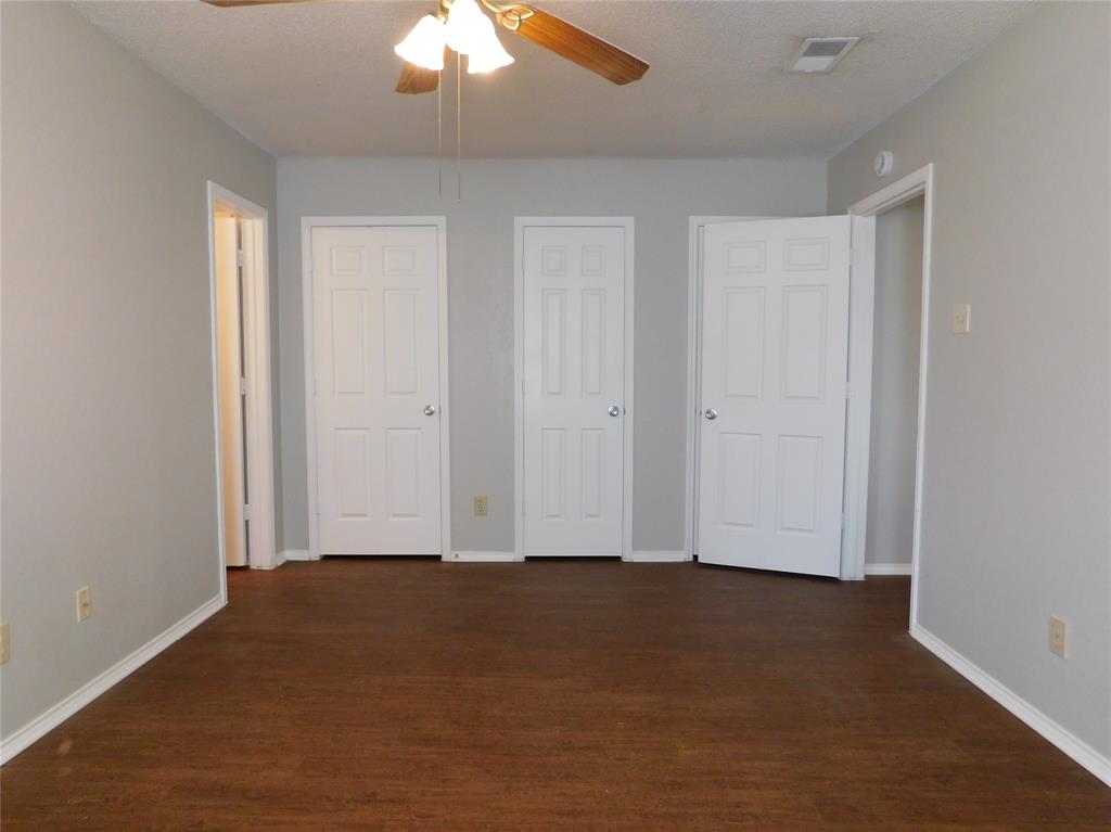 2214 Bernard Street Denton, TX 76205 - Photo 7 of 16 a view of an empty room and chandelier fan