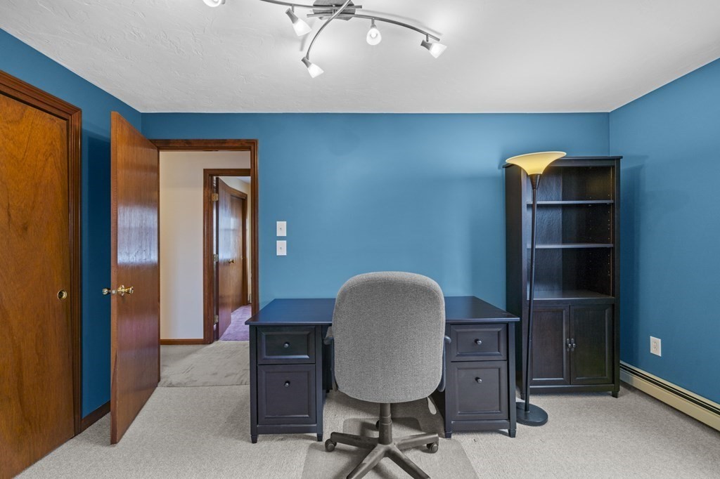 57 Rawson Road Webster, MA 01570 - Photo 29 of 36 a view of a workspace with furniture and a window
