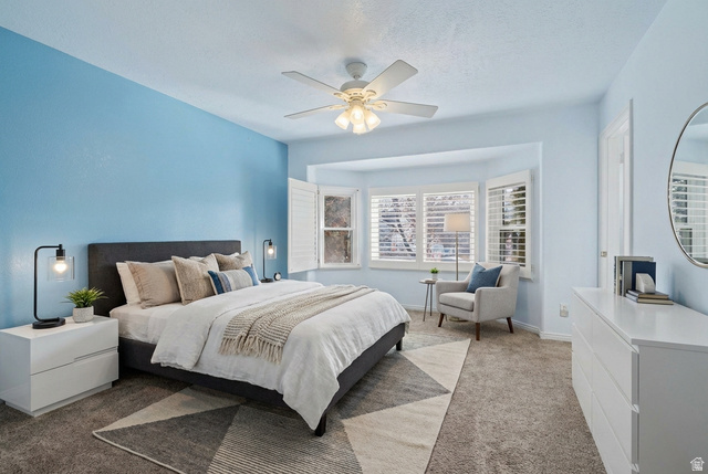 281 Winchester Drive Springville, UT 84663 - Photo 8 of 27 Bedroom with light carpet, ceiling fan, and a textured ceiling