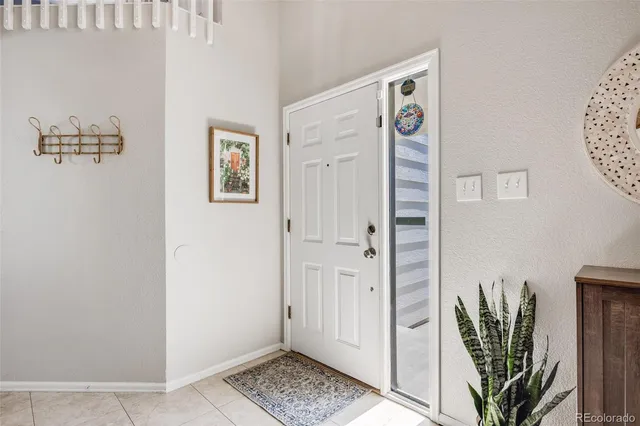 a view of a hallway with paintings on the wall