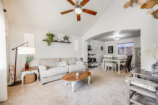 a living room with furniture and a table