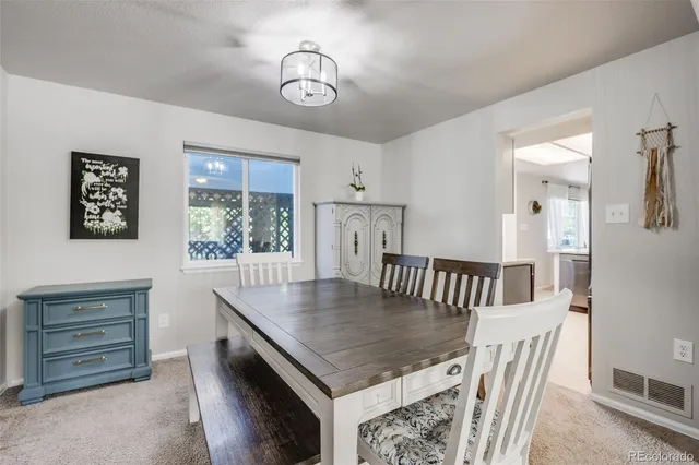 a view of a dining room and chandelier