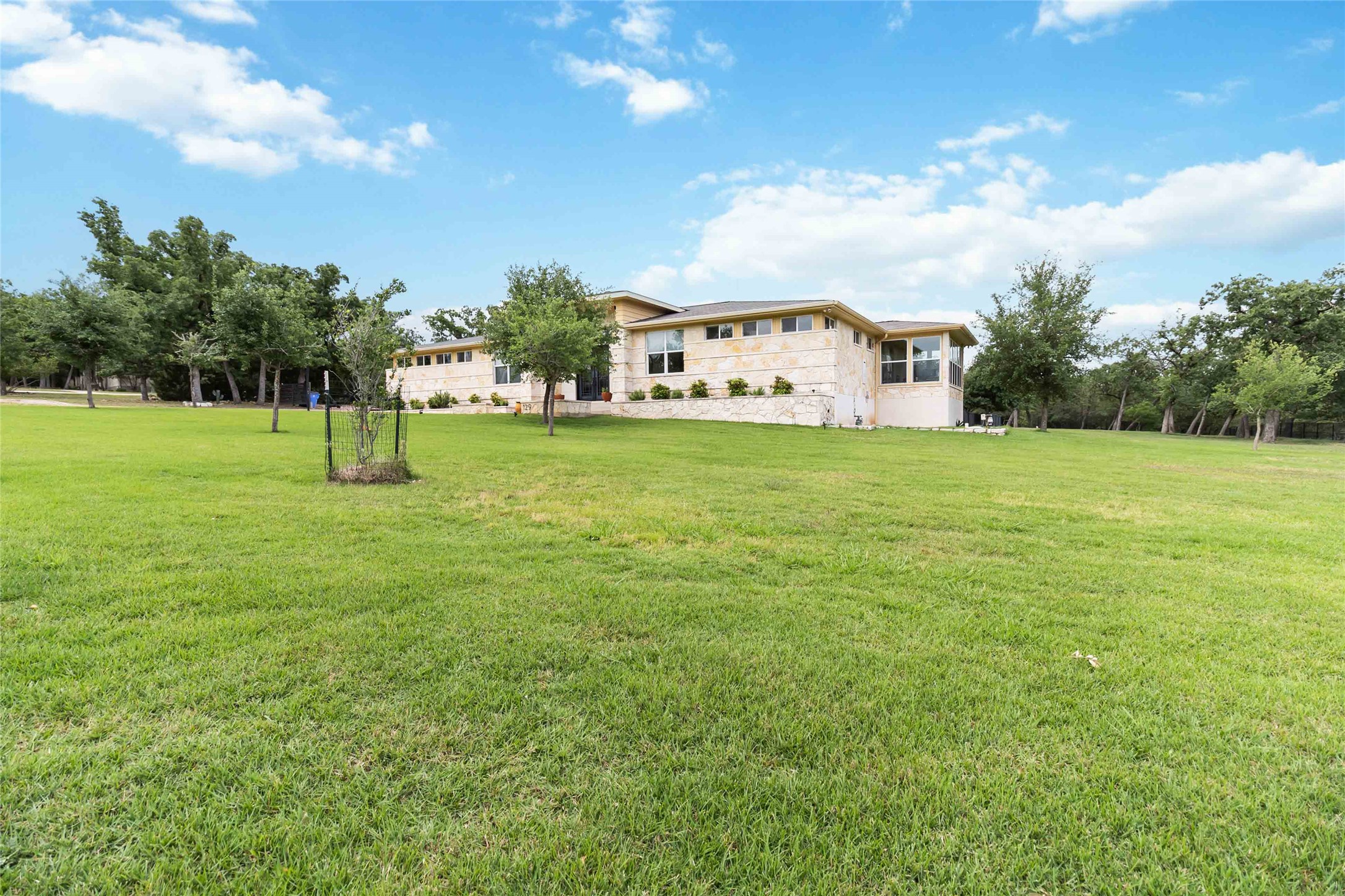 129 Powder Horn Road Bastrop, TX 78602 - Photo 3 of 27 View of grassy yard