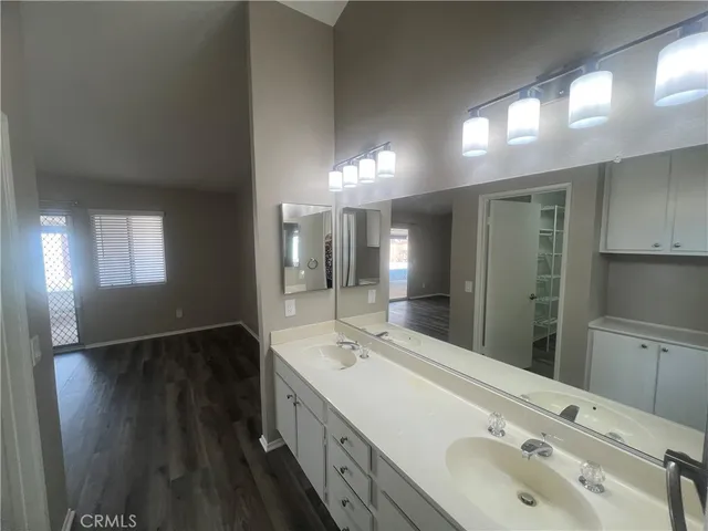 wooden floor in an empty room with a fireplace