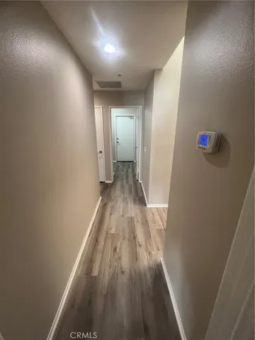 a view of empty room with wooden walls