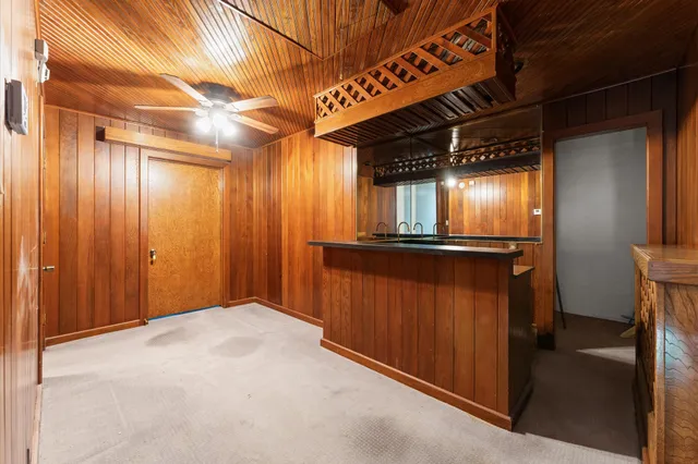 a view of house with a backyard