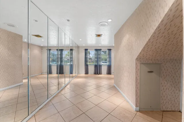 a view of an entryway with wooden floor