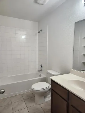 a bathroom with a toilet a sink and a bathtub