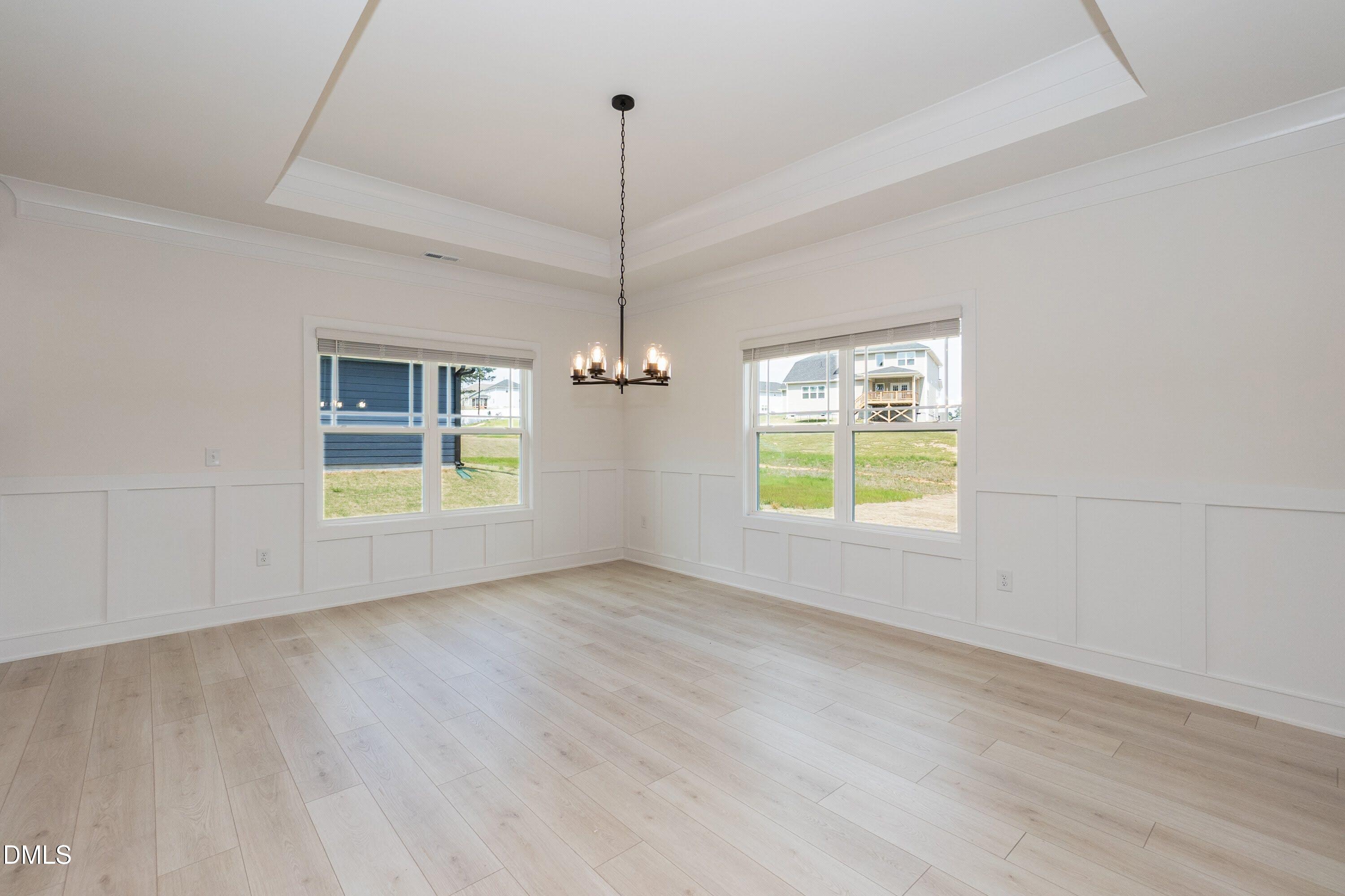 180 Galway Road Lillington, NC 27546 - Photo 16 of 41 a view of an empty room with a window and wooden floor