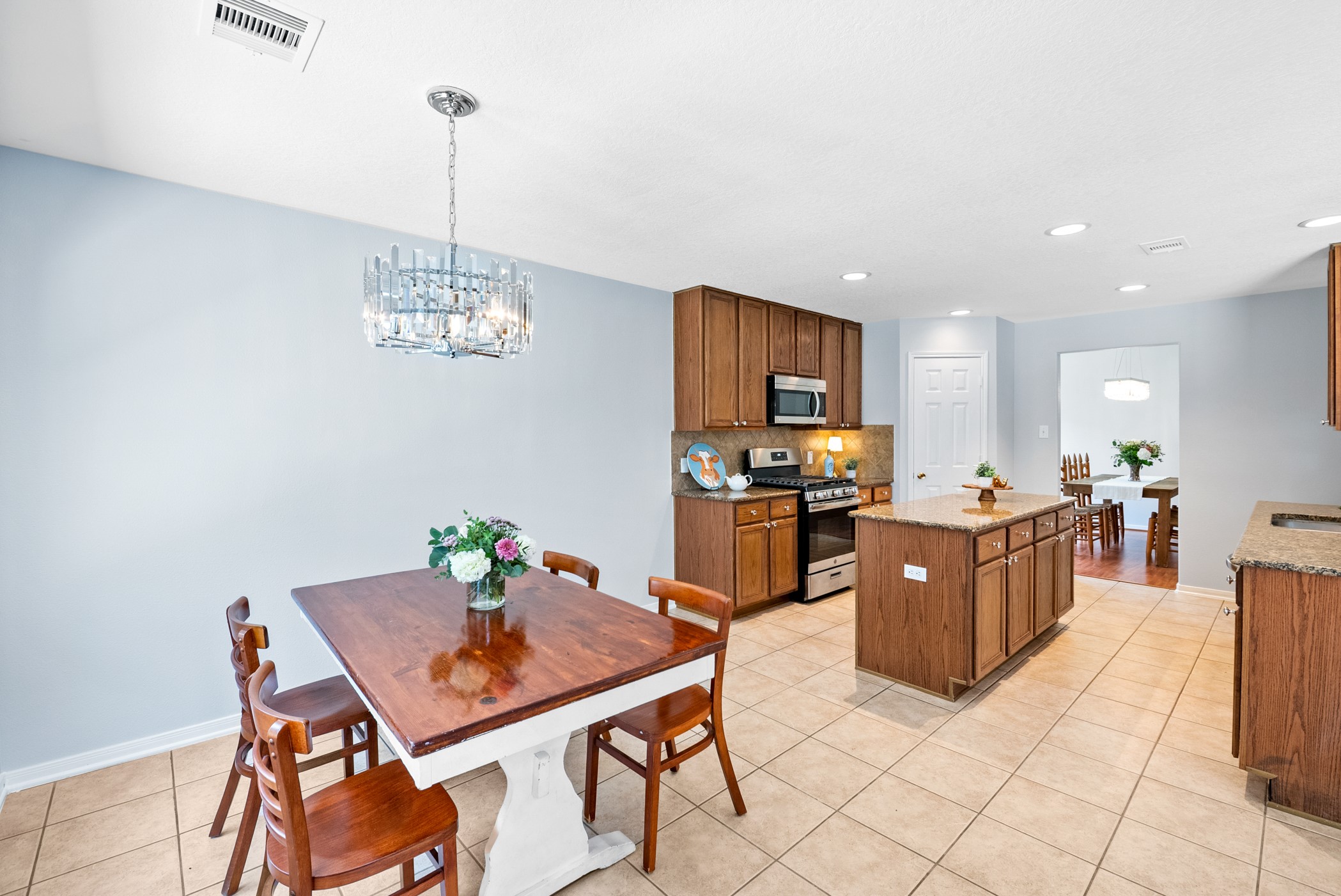2914 Intrepid Elm Street Houston, TX 77084 - Photo 11 of 32 a view of a dining room with furniture