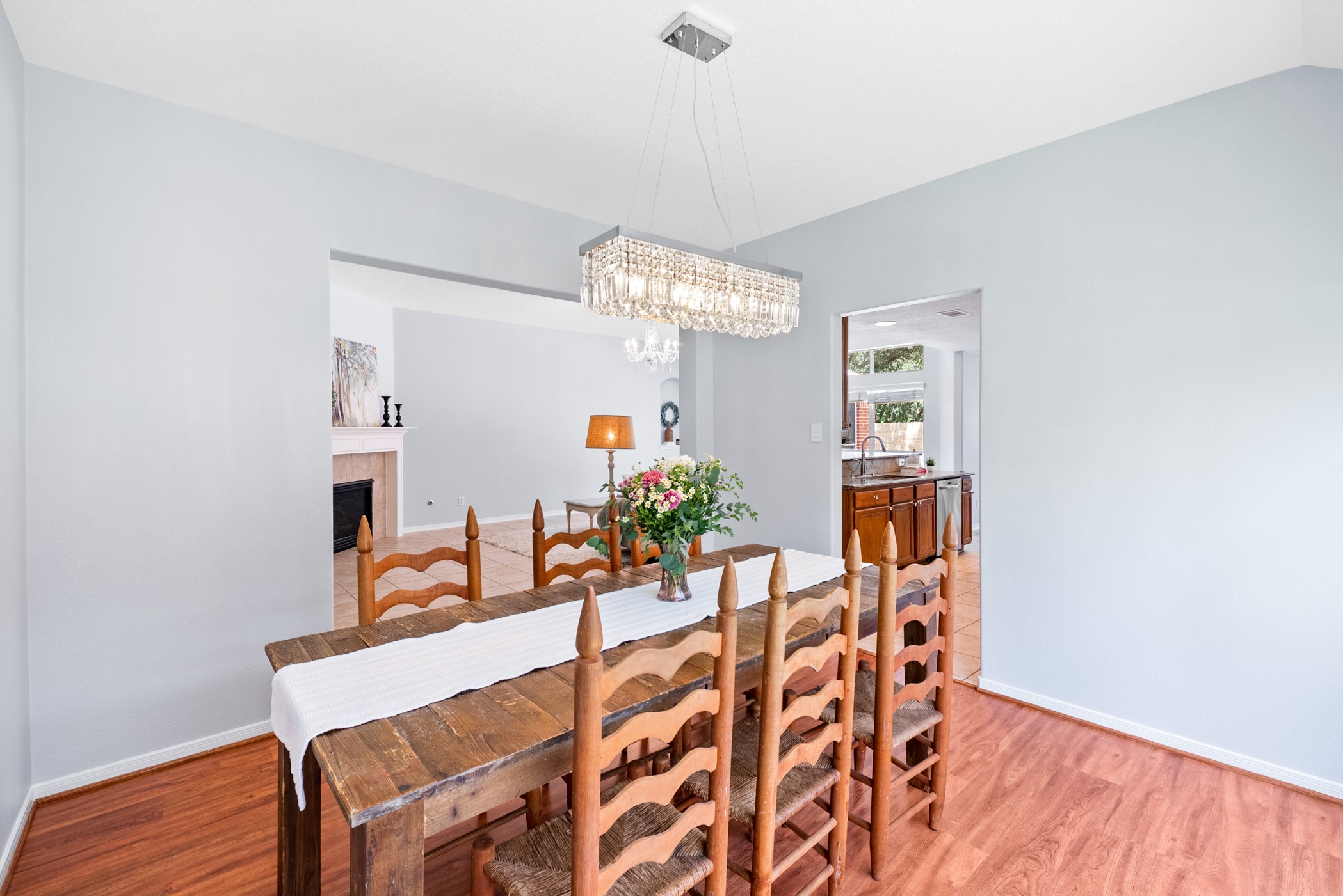 2914 Intrepid Elm Street Houston, TX 77084 - Photo 13 of 32 a view of a dining room with furniture and wooden floor
