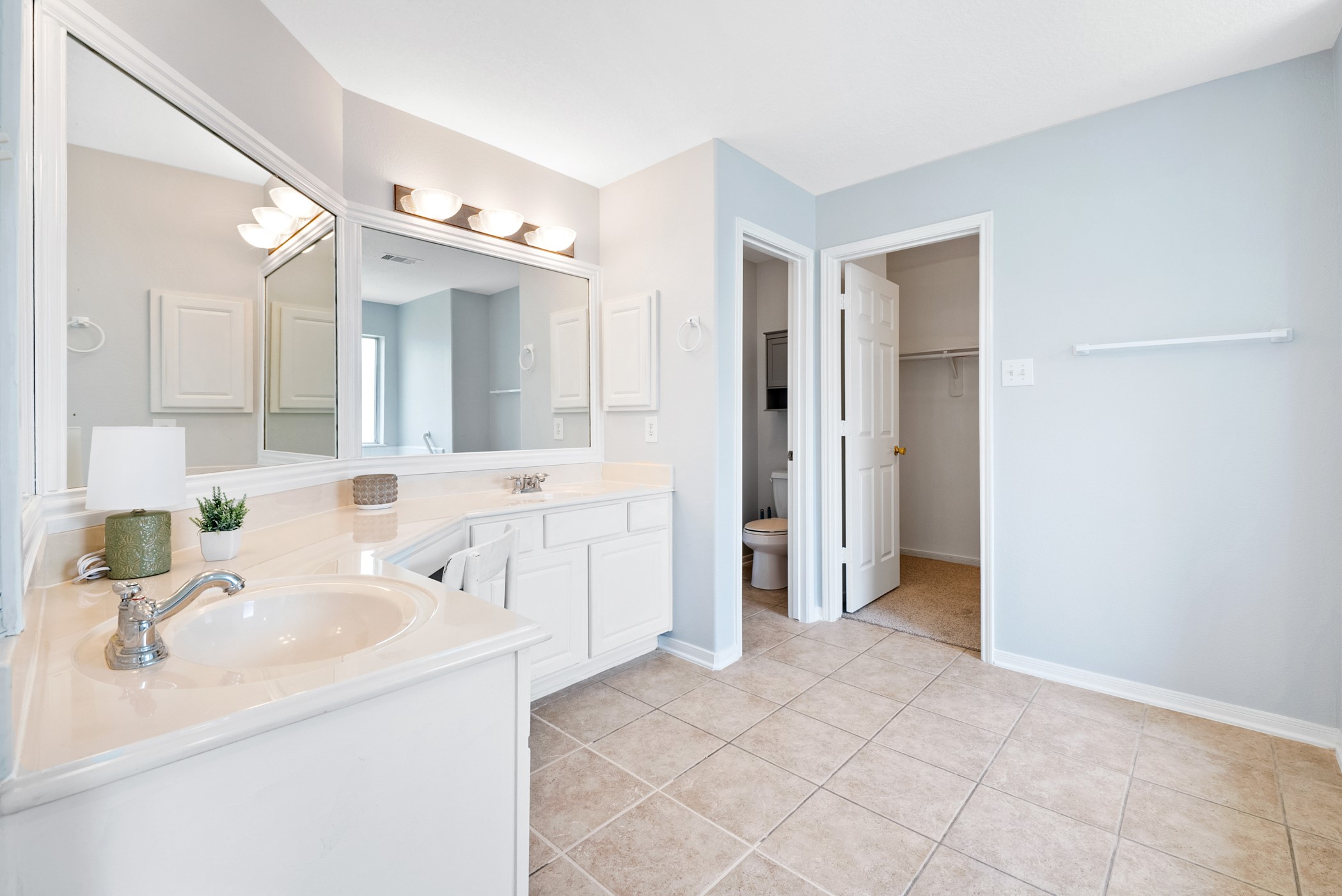 2914 Intrepid Elm Street Houston, TX 77084 - Photo 16 of 32 a bathroom with a sink and a mirror