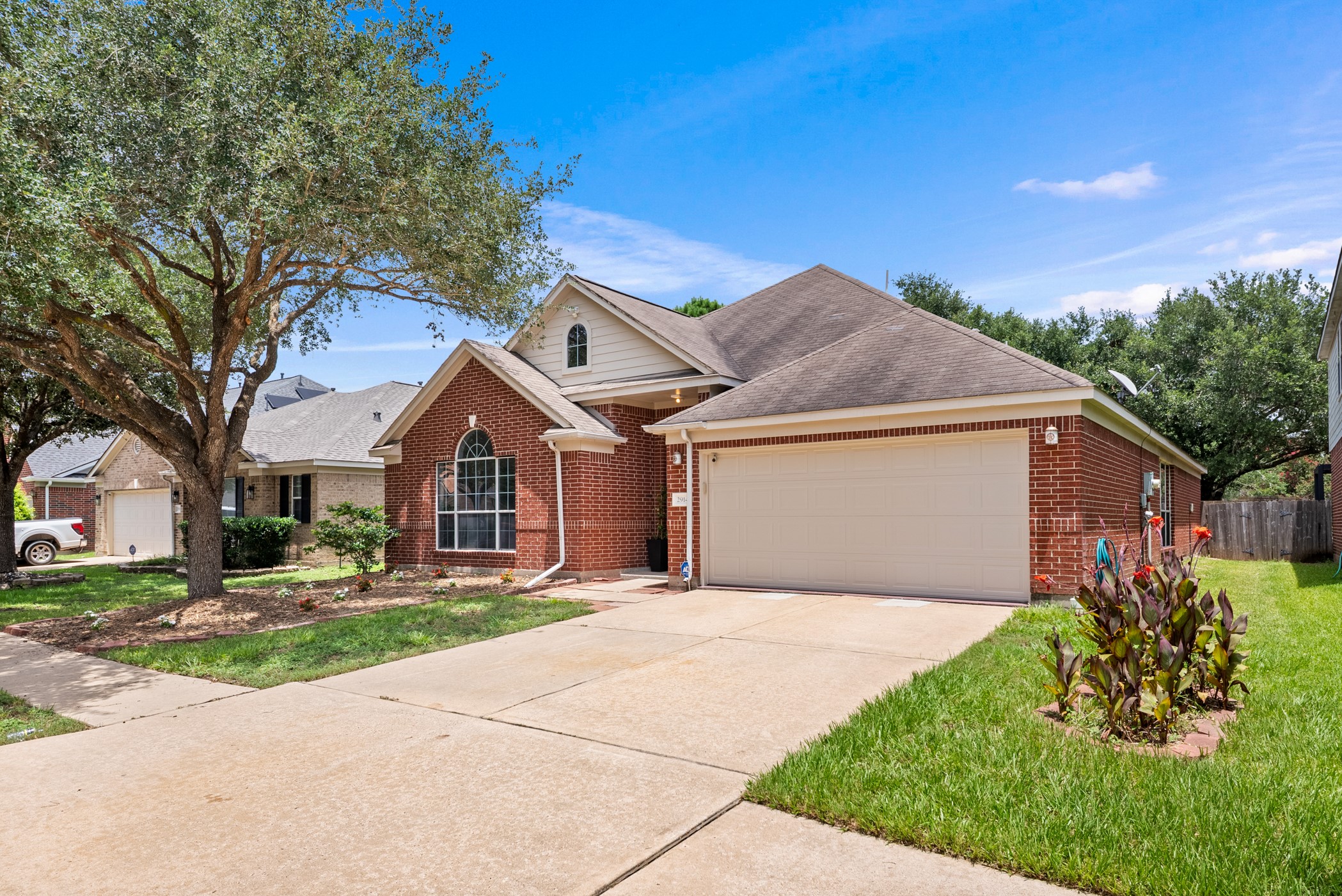 2914 Intrepid Elm Street Houston, TX 77084 - Photo 2 of 32 a front view of house with yard and trees around
