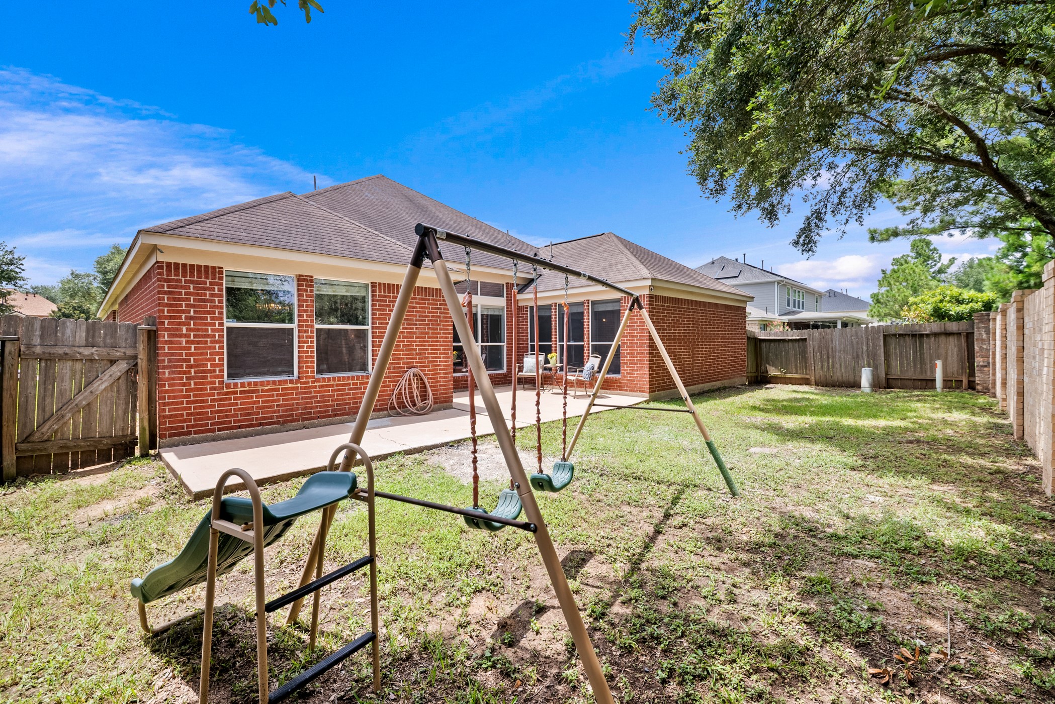 2914 Intrepid Elm Street Houston, TX 77084 - Photo 31 of 32 a view of a house with backyard porch and sitting area
