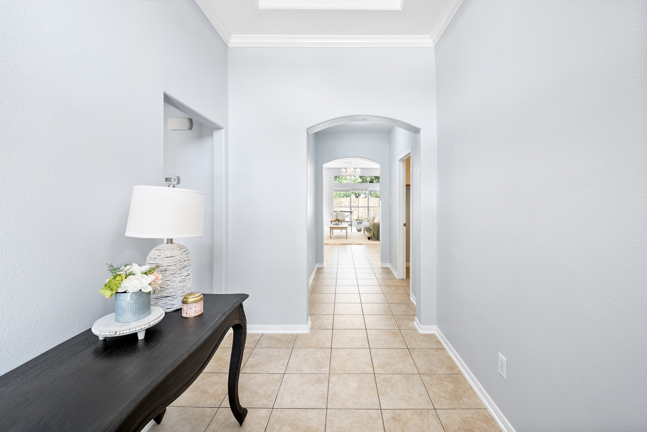 2914 Intrepid Elm Street Houston, TX 77084 - Photo 5 of 32 a hallway with a dining table and chairs