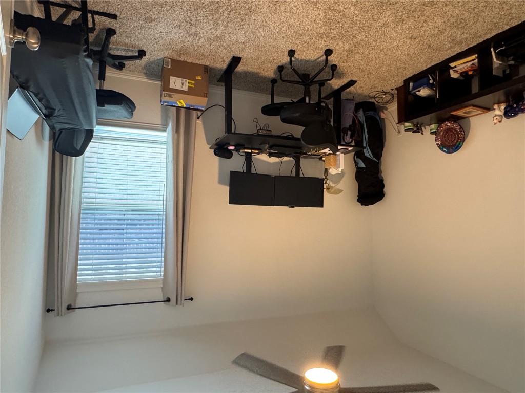 2005 Long Shadow Lane Georgetown, TX 78628 - Photo 12 of 21 Office with light carpet, vaulted ceiling, and ceiling fan