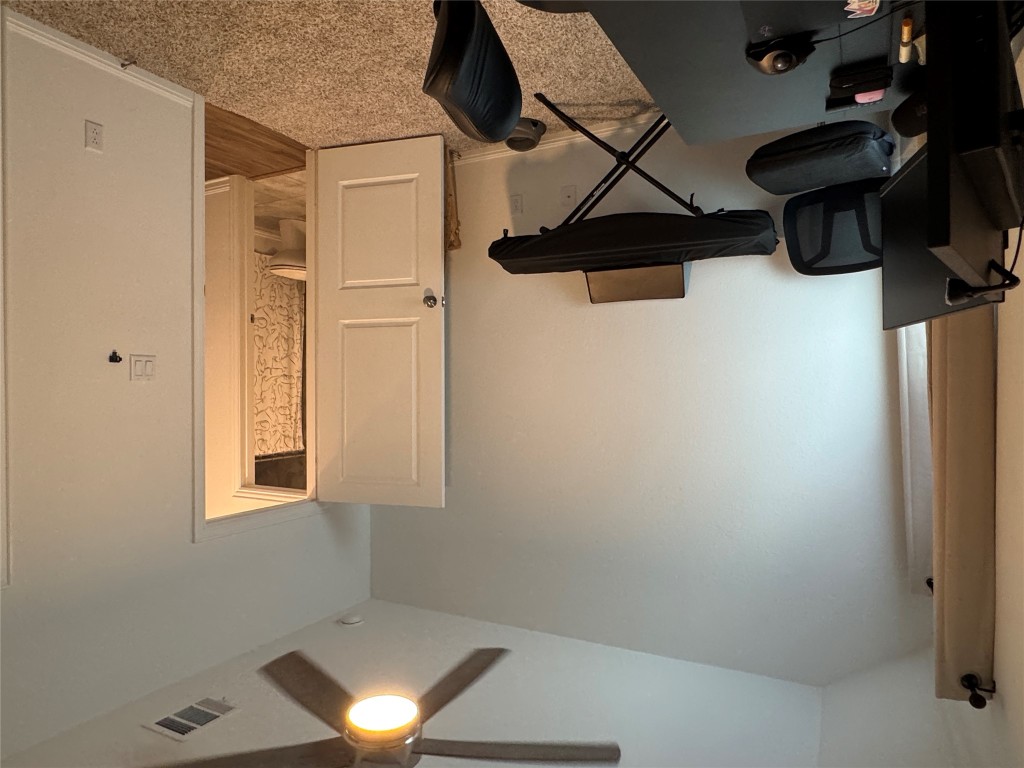 2005 Long Shadow Lane Georgetown, TX 78628 - Photo 13 of 21 Home office featuring carpet and ceiling fan