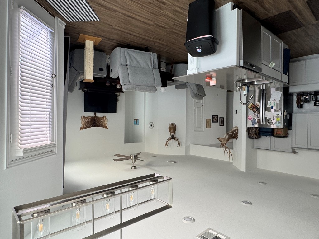 2005 Long Shadow Lane Georgetown, TX 78628 - Photo 21 of 21 Kitchen with a ceiling fan, refrigerator, dark wood finished floors, and open floor plan