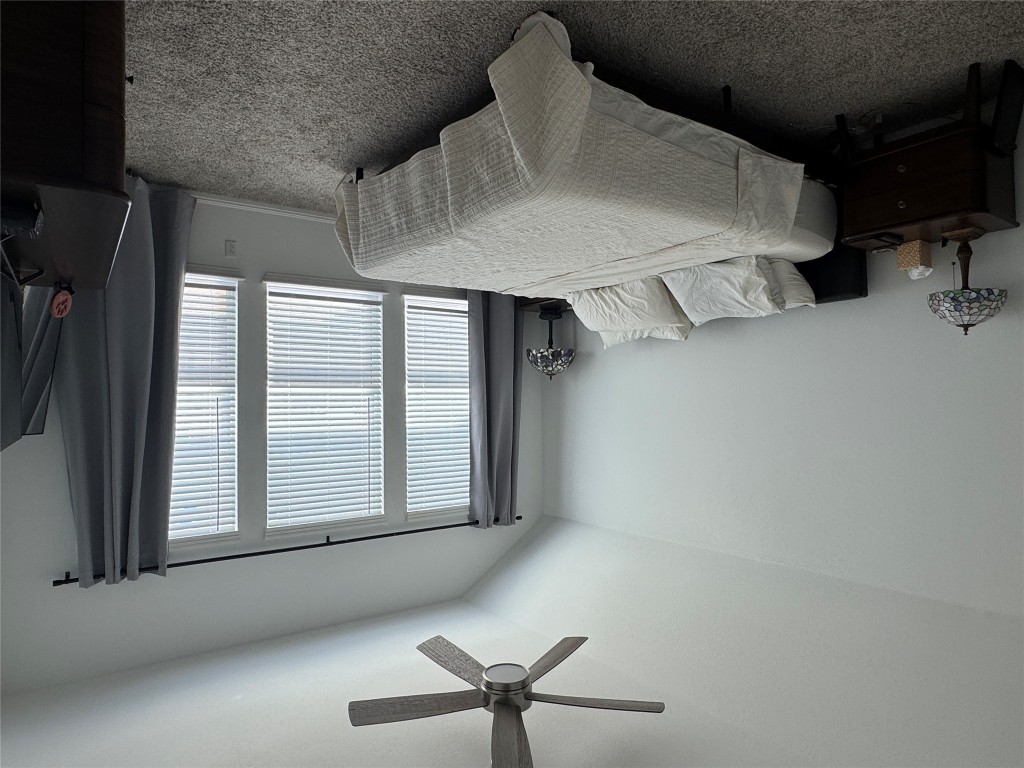 2005 Long Shadow Lane Georgetown, TX 78628 - Photo 17 of 21 Bedroom featuring carpet floors, lofted ceiling, and ceiling fan