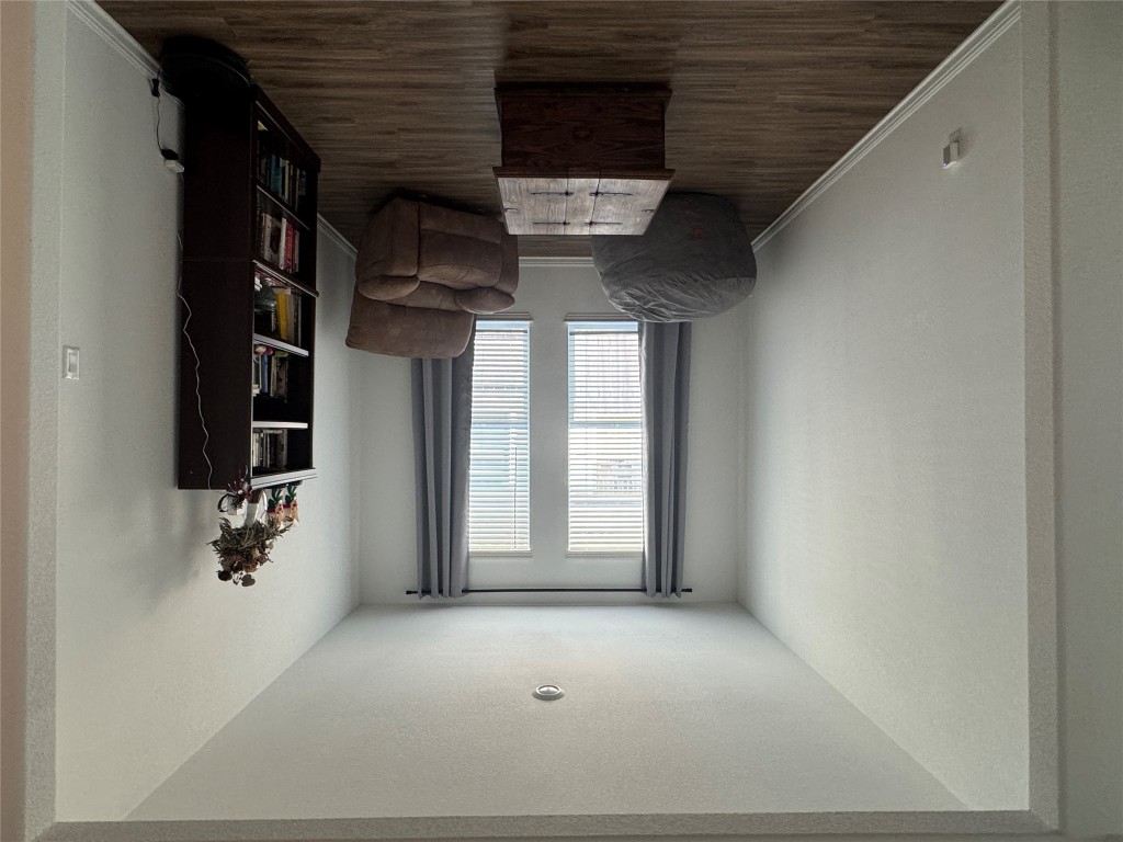 2005 Long Shadow Lane Georgetown, TX 78628 - Photo 9 of 21 Sitting room featuring dark wood-style flooring and a textured ceiling