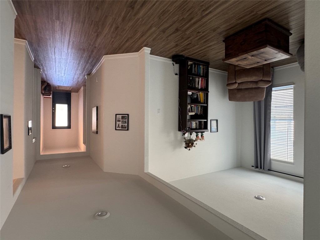 2005 Long Shadow Lane Georgetown, TX 78628 - Photo 10 of 21 Sitting room with dark wood-style flooring and baseboards