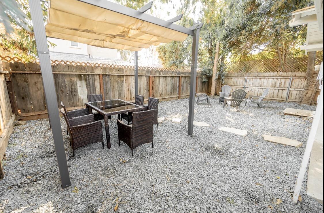 232 Ash Street Exeter, CA 93221 - Photo 4 of 13 a view of a chairs and table in the yard