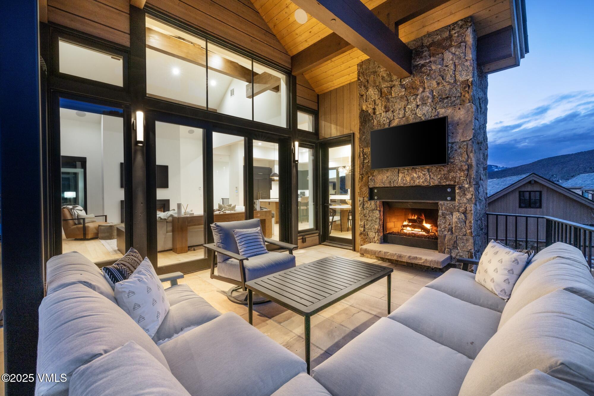 100 Legends Drive, Unit D Edwards, CO 81632 - Photo 14 of 37 a living room with furniture a fireplace and a flat screen tv