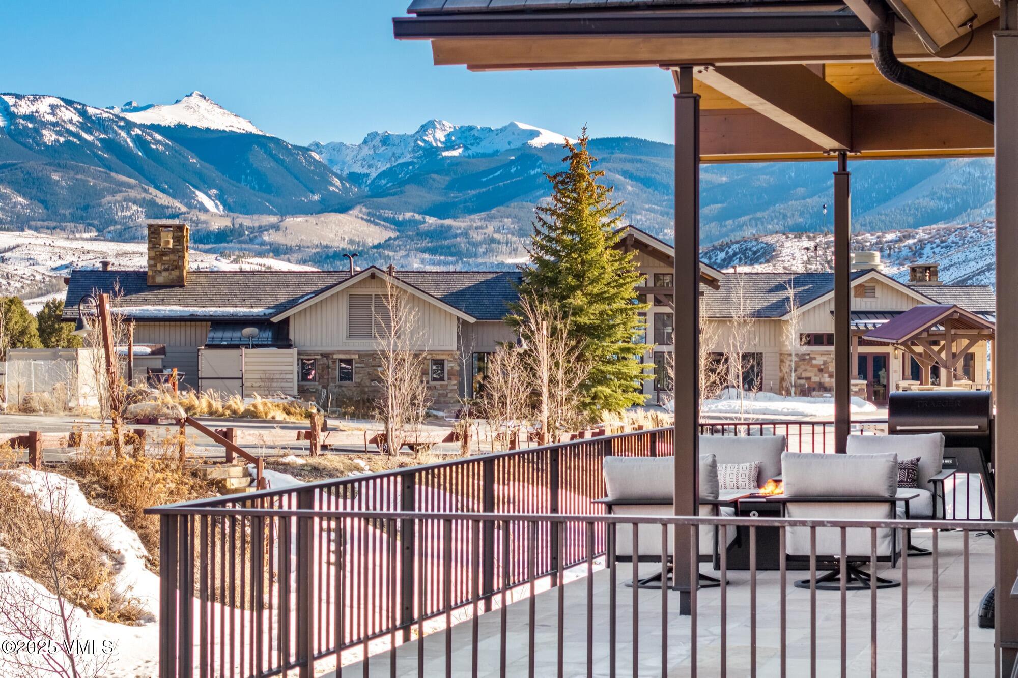100 Legends Drive, Unit D Edwards, CO 81632 - Photo 15 of 37 a view of a house with a small yard and deck