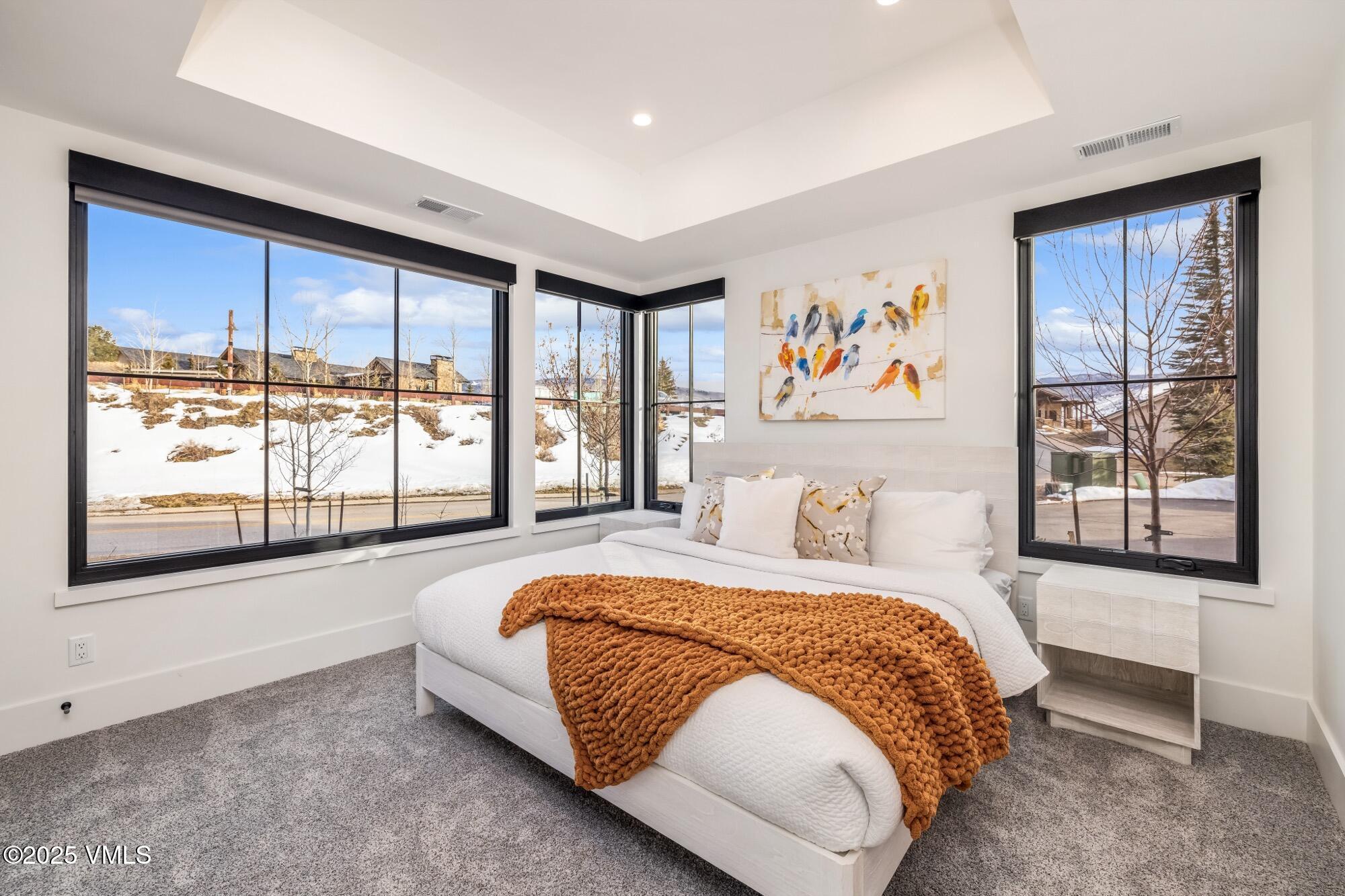 100 Legends Drive, Unit D Edwards, CO 81632 - Photo 27 of 37 a spacious bedroom with a large bed and a large window