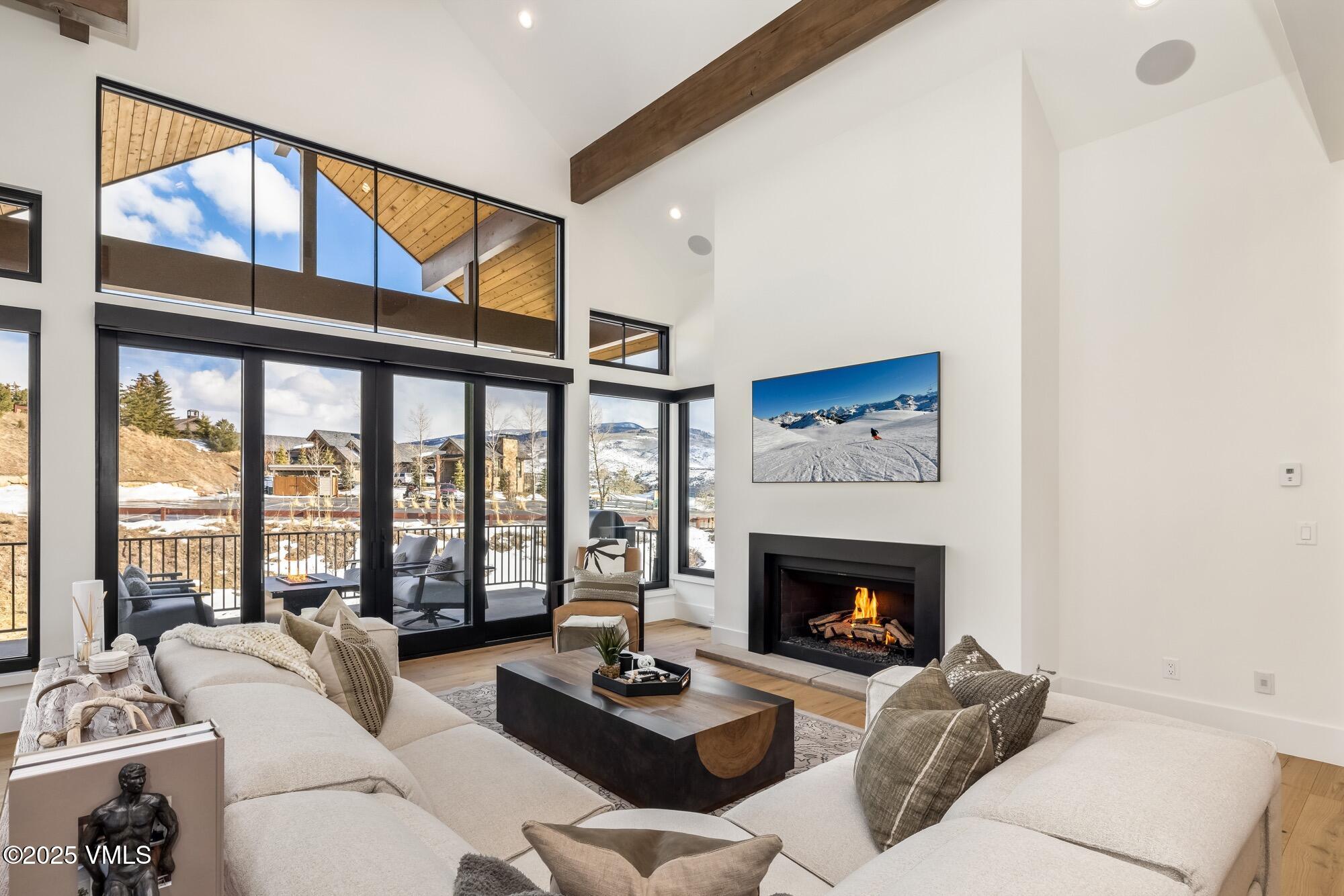 100 Legends Drive, Unit D Edwards, CO 81632 - Photo 7 of 37 a living room with furniture large window and a fireplace