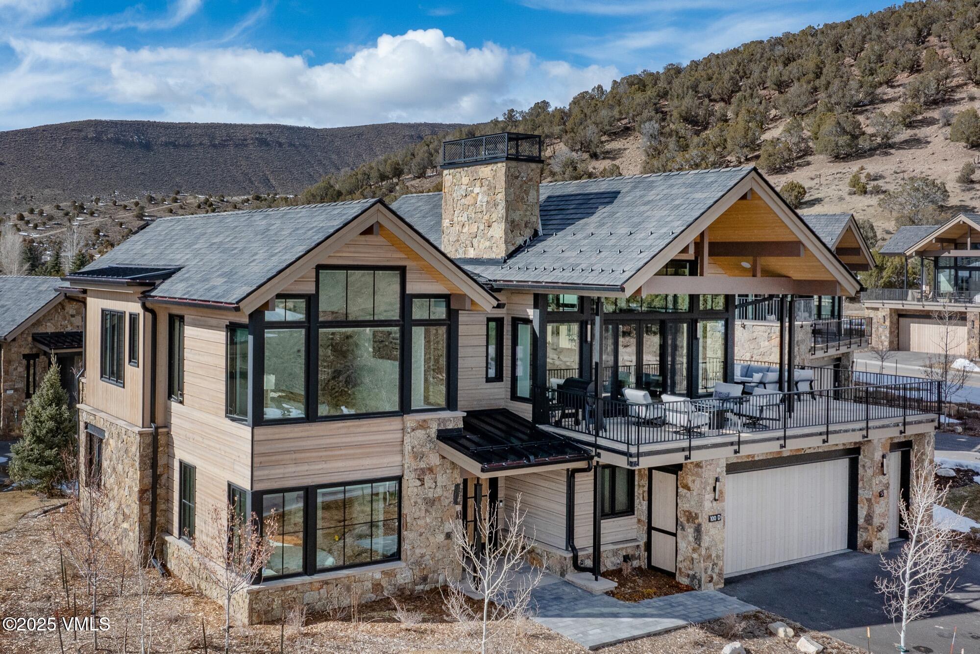 100 Legends Drive, Unit D Edwards, CO 81632 - Photo 9 of 37 a front view of a house with balcony and outdoor seating