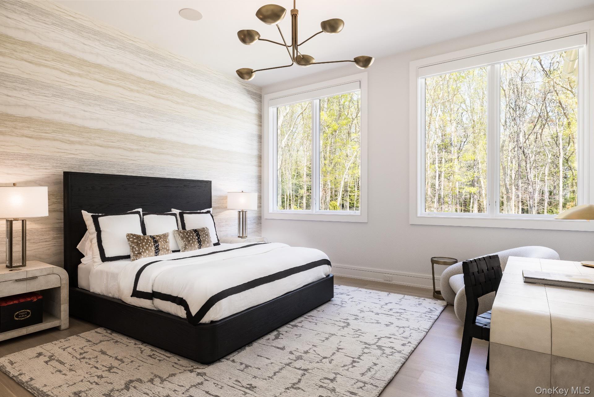 1552 Deerfield Road Water Mill, NY 11976 - Photo 19 of 37 a bedroom with a large bed and a window