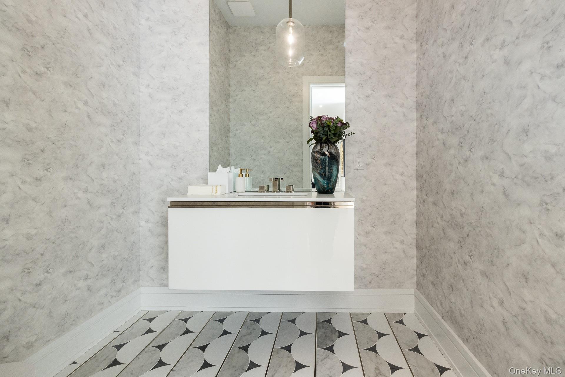 1552 Deerfield Road Water Mill, NY 11976 - Photo 21 of 37 a bathroom with a sink a vanity and a mirror