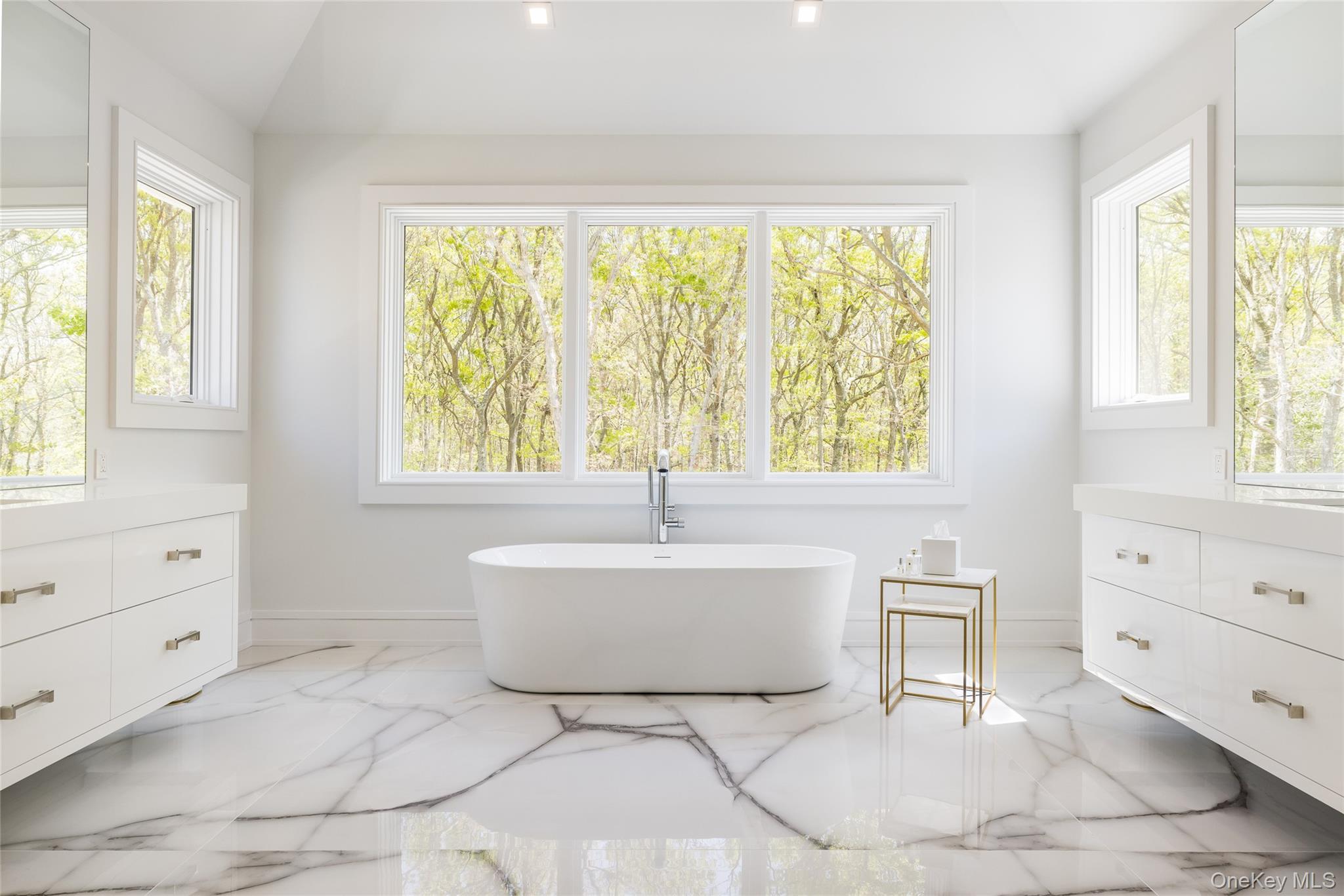 1552 Deerfield Road Water Mill, NY 11976 - Photo 23 of 37 a bath room with a window and a dresser
