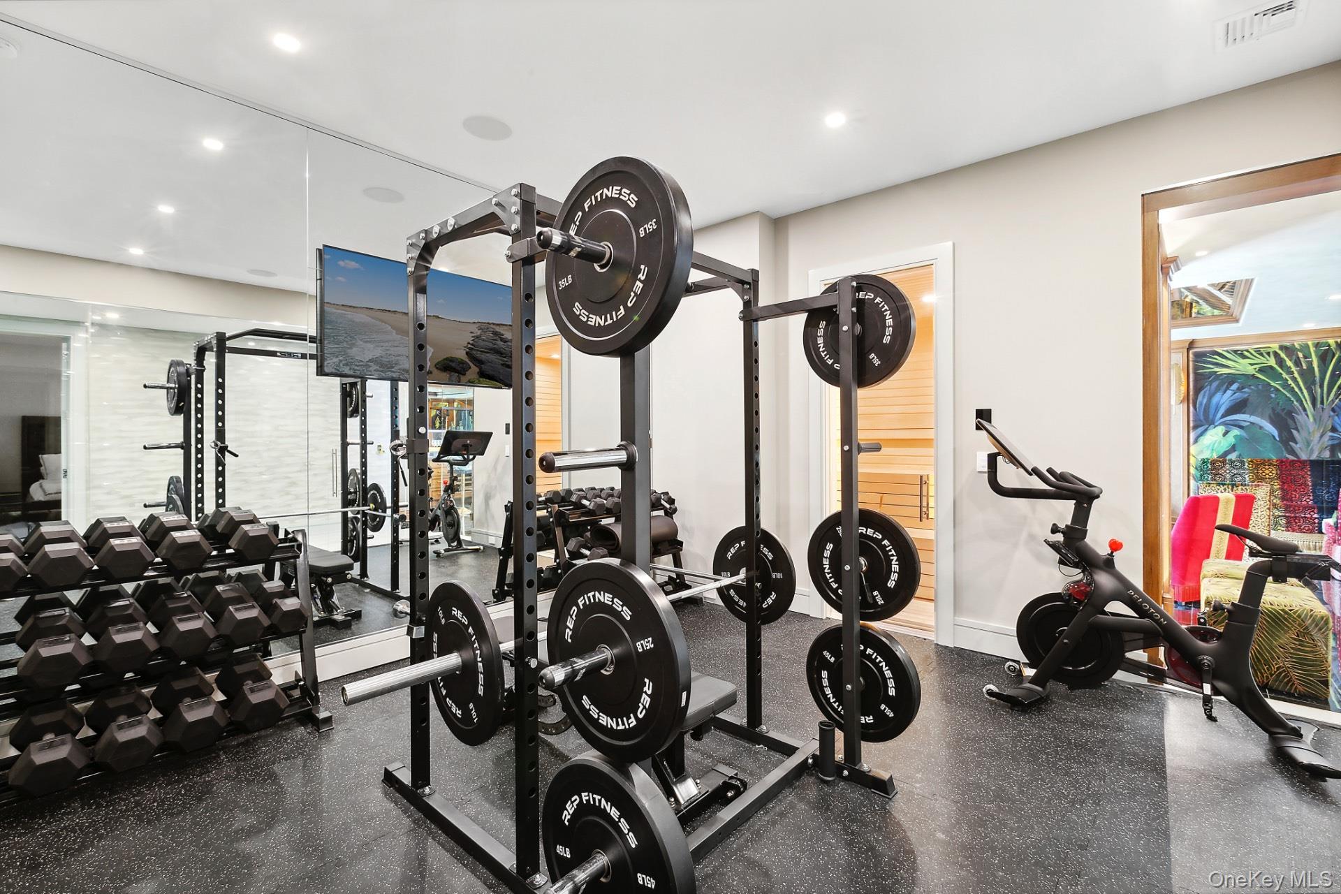 1552 Deerfield Road Water Mill, NY 11976 - Photo 33 of 37 a view of a room with gym equipment
