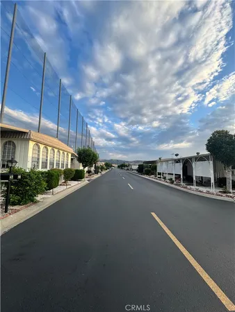 a view of a city street both side of house