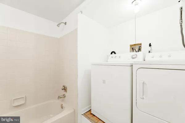 a bathroom with a bathtub and a sink