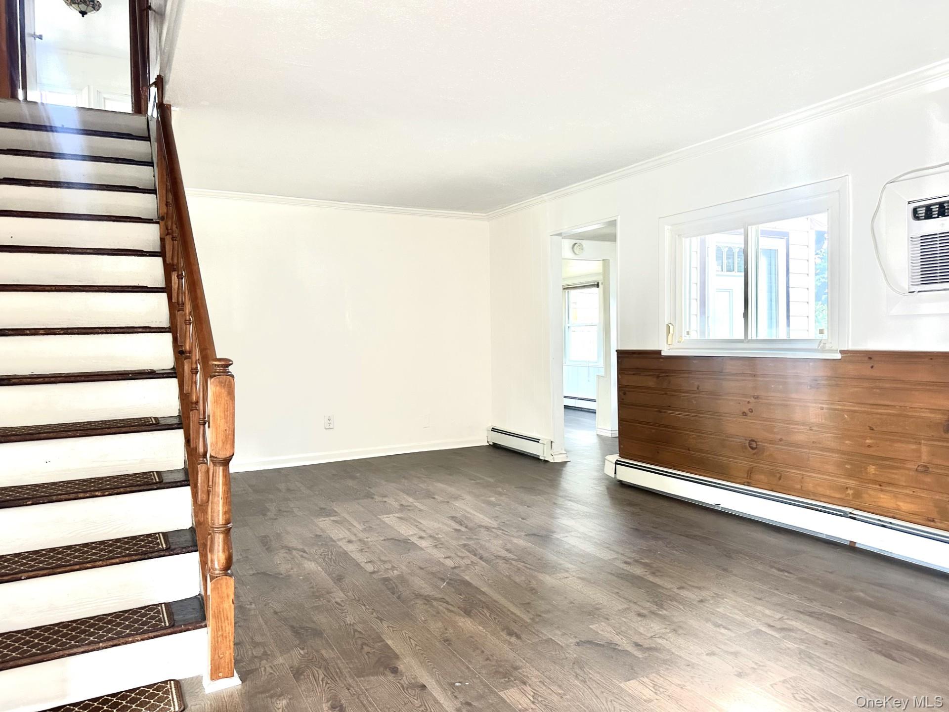 27 Collins Road Glen Cove, NY 11542 - Photo 6 of 13 a view of an empty room with a window