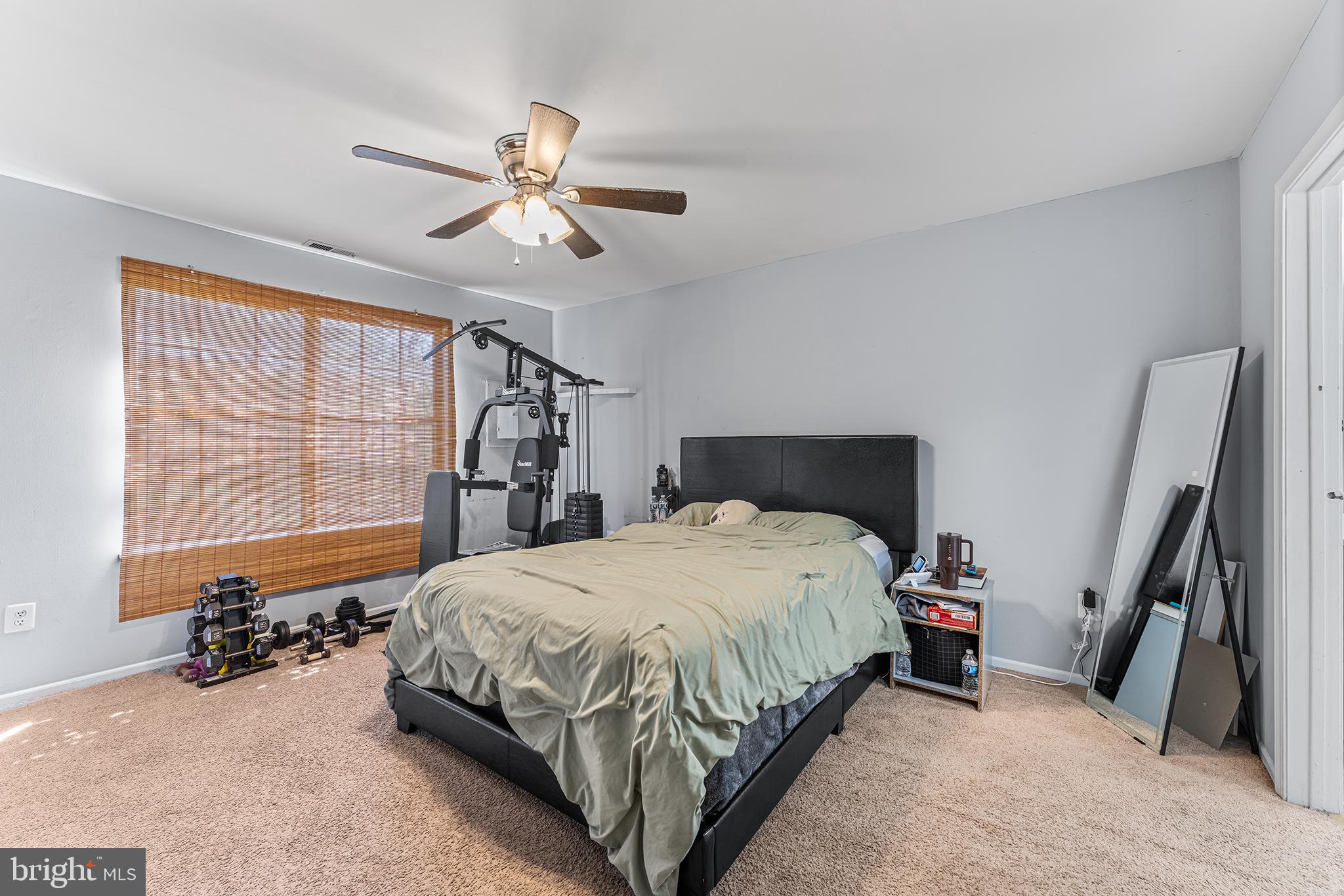 16 Devon Place Sewell, NJ 08080 - Photo 13 of 22 a bedroom with a bed and a chandelier
