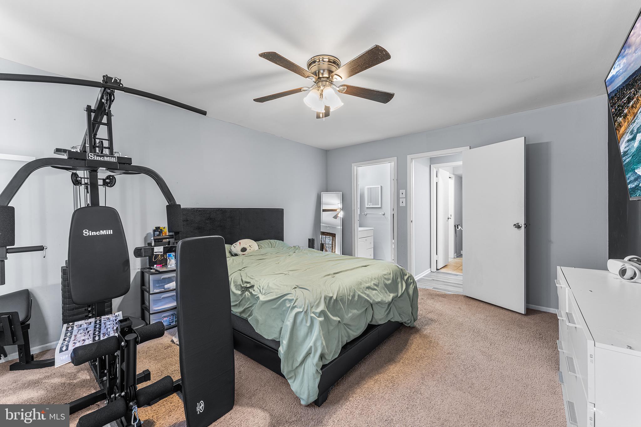 16 Devon Place Sewell, NJ 08080 - Photo 15 of 22 a bedroom with a bed and a chandelier